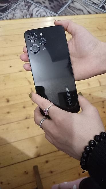 samsung a 10: Məhsul: Redmi smartfon Xüsusiyyətlər: - Rəng: Qara, parlaq arxa panel — 1