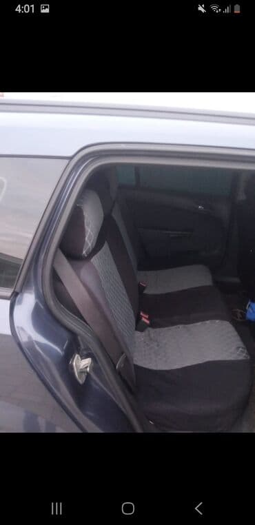 opel 1994: Opel Astra Caravan (universal kuzov) – tünd mavi rəng - Kuzov: 5 — 3