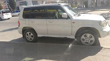 daewoo lanos nece masindir: Mitsubishi Pajero iO (GDI) – ağ rəngli, 5 qapılı kompakt SUV. İlkin — 3