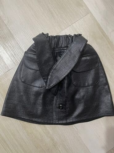 dəridən qadın ətəkləri: Qara rəngli süni dəri ətək.6-7 yash seliqeli yeninkimi, kemeri kim — 1