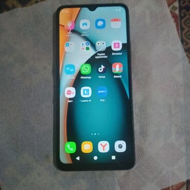 qara çanta: Redmi smartfon - Model: Redmi (arxa qapaqda “Redmi” loqosu və dairəvi — 4