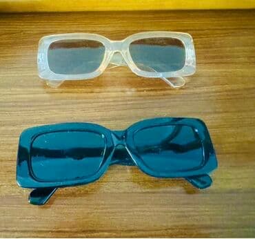 şəffaf eynəklər: Düzbucaqlı formalı, şəffaf və qara rəngdə iki ədəd günəş eynəyi. Bu — 1