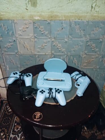 сколько стоит playstation 4: Açıq mavi rəngdə olan bu oyun konsolu dəsti evdə əyləncə üçün — 1