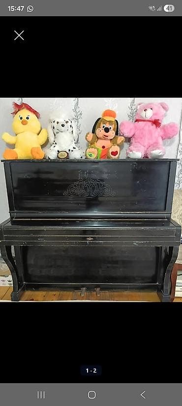 Upright pianino – klassik qara korpuslu, dekorativ oyma naxışlı qabaq — 1