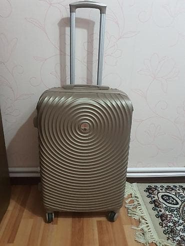 Velosipedlər: Sərnişin çamadanı – sərt korpuslu, spiral naxışlı, qızılı-bej rəng. - — 2