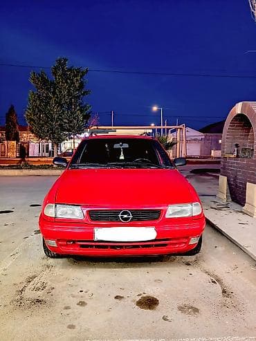 vaz 2107 maşını: Opel Astra F Caravan (universall) – qırmızı rəng. şəxsi sahibiyəm Heç — 1