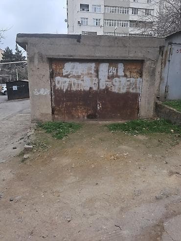 Metall qapılı qaraj/boksa uyğun tikili - Beton konstruksiyalı, üzəri