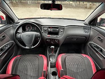 kia optima oluxanasi: Kia Rio sedan – qırmızı rəng, 4 qapı, kompakt şəhər avtomobili. - — 7