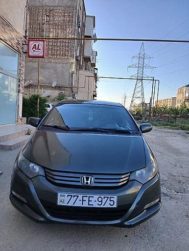 mazda 3: Honda Insight: 1.3 l | 2010 il Hetçbek — 1