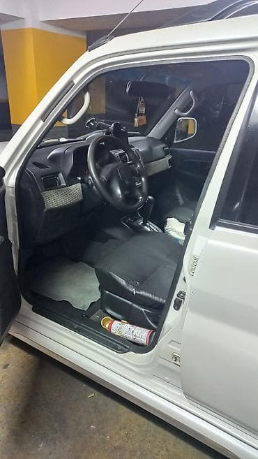 pajero io: Mitsubishi Pajero: 2 l | 2000 il 348858 km Ofrouder/SUV — 7