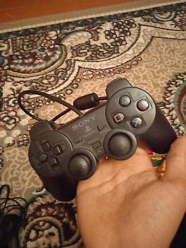 аудио усилитель купить: Real alıcıya 55mPlayStation 2 Slim oyun konsolu. Komplektə şəkildə — 4