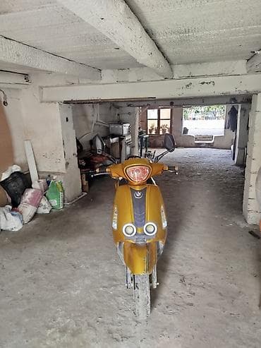 en ucuz moped: Sarı rəngdə ZigZag skuter Xüsusiyyətlər və təchizat: - Korpus — 3