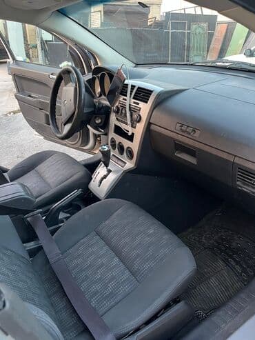 Avtomobil alışı: Dodge Caliber – gümüş rəngli, 5 qapılı hatchback. Əsas xüsusiyyətlər — 9