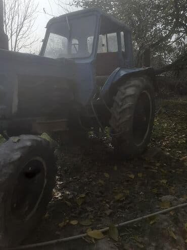 yuk avtomobilleri satisi: Mavi rəngli təkərli traktor Texniki xüsusiyyət və üstünlüklər: - — 4
