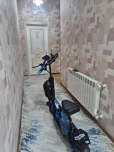 qaz 31 105: Elektrikli skuter – güclü, oturacaqlı model Xüsusiyyətlər:Skuter tam — 7