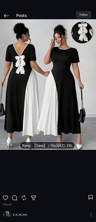 Qara rəngdə zərif qadın paltarı. A-kesim maxi uzunluq, qısaqollu