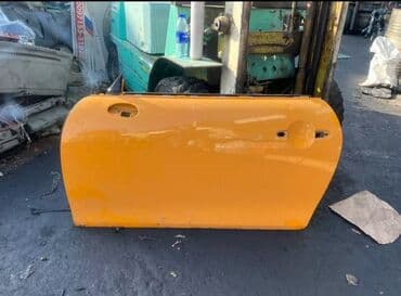 on suse: Narıncı rəngdə olan Mini Cooper avtomobil qapısı. Qapı dəstəyi və — 1
