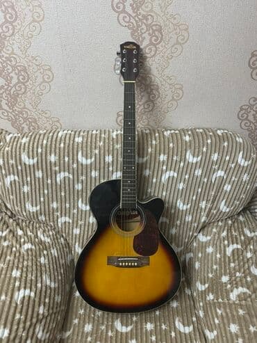 qedim saatlar haqqında melumat: Elektro-akustik gitara – cutaway korpuslu, sunburst ön qapaqlı model — 1