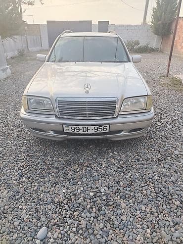 opel astra k: Mercedes-Benz C‑Class Universal (W202) – gümüş rəngli stansiyon vaqon — 2