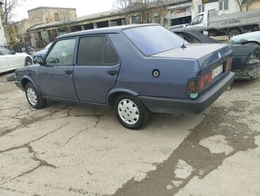 taksi maşınları: Model: Tofas Şahin/Doğan sedan (mavi rəng) Kuzov: 4 qapılı, klassik — 7