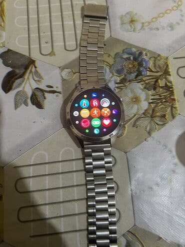 bluetooth klaviatura: Metal qayışlı, dairəvi displeyli ağıllı saat. Xüsusiyyətlər: - Tam — 2