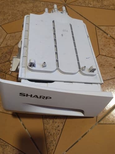 Sharp brendinə məxsus printer üçün çəkmə. Ağ rəngdə olan bu hissə