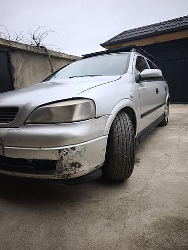 kia optima 2013: Opel Astra Caravan (universal) – gümüş rəngli kuzov, 5 qapı, dam — 7