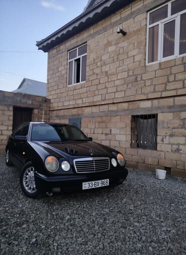 t 150 k traktor: Mercedes-Benz E-Class: 2 l | 1997 il Sedan — 1