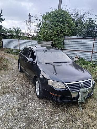 volqa ehtiyat hisseleri: Volkswagen Passat sedan. Avtomobilin salonu qara rəngdədir və ön — 5