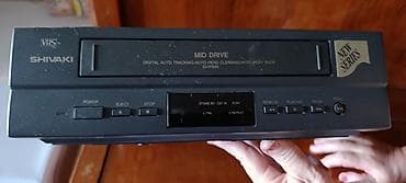 Digər TV və video məhsullar: Shivaki VHS videomaqnitofon. Ön paneldə “MID DRIVE” sistemi qeyd — 1
