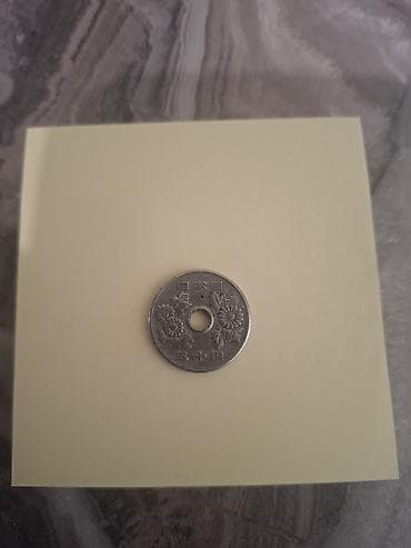 20 cent nece qepikdir: Yaponiya 50 yen sikkəsi (mərkəzdə deşikli) - Nominal: 50 yen - — 1