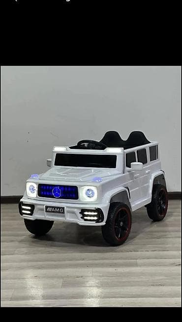 Uşaq geyimi və ayaqqabıları: Uşaq elektrik maşını – ağ rəngdə, SUV tipli model (G‑class üslubu) — 1
