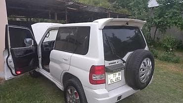 mitsubishi pajero satilir: Mitsubishi Pajero iO, ağ rəngli, 3 qapılı kompakt SUV. Xarici: - Ağ — 3