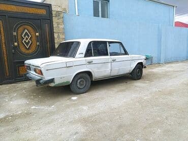 ваза стеклянная прозрачная высокая без узора: VAZ 2106, ağ rəngli, sedan kuzov. Xüsusiyyətlər: - Klassik “06” — 5