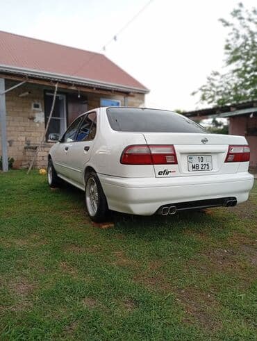 Nissan Sunny: 1.6 л | 2000 г. Седан — 5