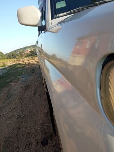 турбо аз трактор: Ağ rəngli, 4 qapılı Mitsubishi Pajero SUV. Avtomobilin arxa hissəsində — 9