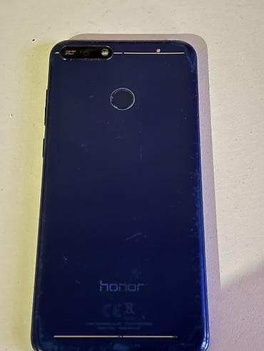 Мобильные телефоны и аксессуары: Honor 7A, цвет - Голубой, Отпечаток пальца — 7