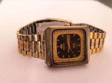 el fecr saat: İşlənmiş, Qol saatı, Orient, rəng - Qızılı — 1