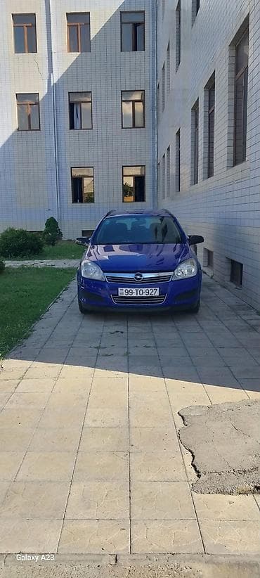 larzon disk: Opel Astra Caravan (universal), mavi rəng. Kuzov: 5 qapılı, geniş — 2