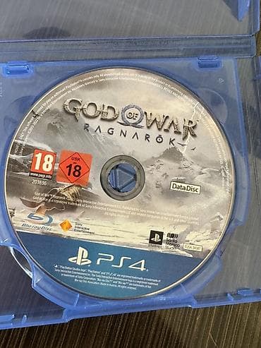 Видеоигры и приставки: PS4 üçün **God of War Ragnarök** oyun diski. Diskin üzərində **Data — 1