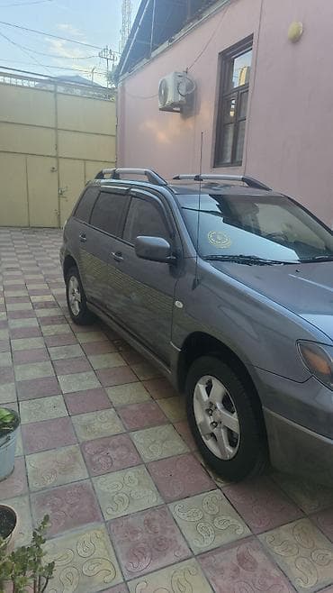 barter disk: Mitsubishi Outlander – boz rəngli, universallığı və rahatlığı ilə — 4