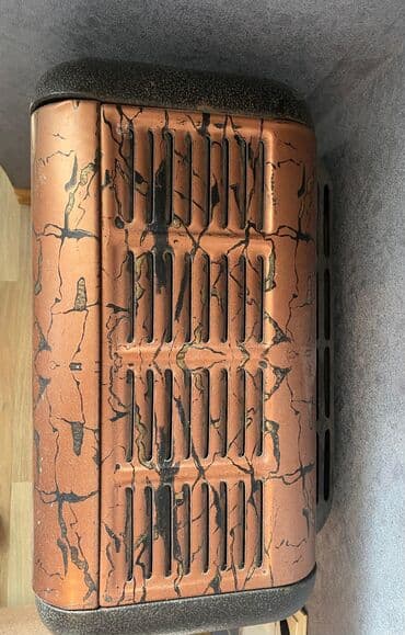 qızdırıcı konvektor: Qəhvəyi və qara rənglərdə dizayn edilmiş portativ qaz sobası. Kompakt — 5