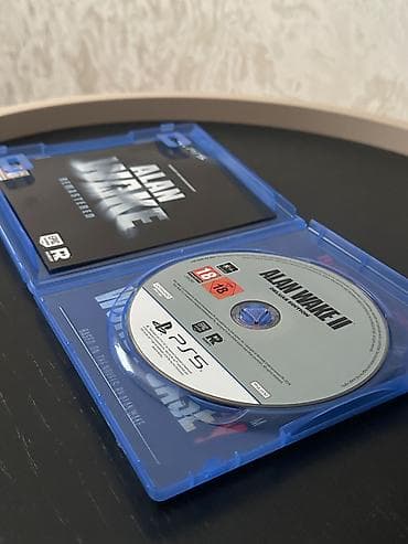 oyun notbuk: Playstation 5 üçün Alan Wake 2 Deluxe Edition satılır. Disk və qabın — 2