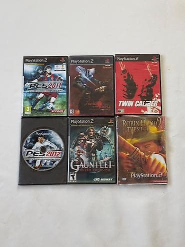 playstatio: PlayStation 2 oyun konsolu dəsti. Dəstə şəkildə görünənlər daxildir — 4