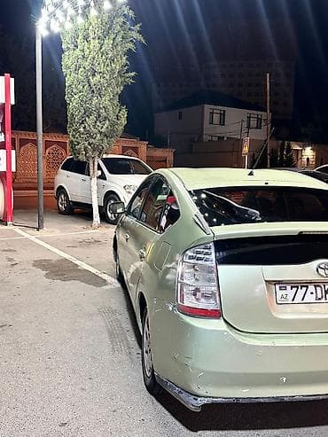 baqaj: Toyota Prius (2-ci nəsil) hibrid hetçbek - Gümüş-yaşıl rəngli kuzov — 3