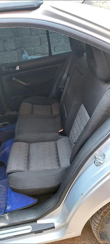 Volkswagen Bora (sedan), gümüşü rəng. - Salon: qara parça oturacaqlar — 3