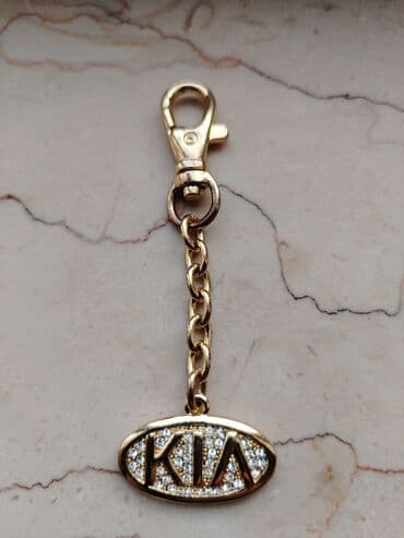 Qoşqular: Qızılı rəngli KIA açarlığı - Material: metal ərintisi, parlaq qızılı — 1