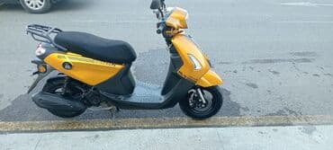купить мопед в кредит: === PART 1: TEXTUAL DESCRIPTION === Sarı rəngli, müasir dizaynlı — 6
