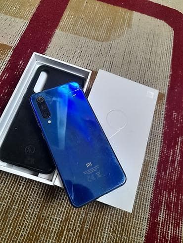 telefon a13: Xiaomi Mi 9 SE, rəng - Mavi, 
 İki sim kartlı — 2