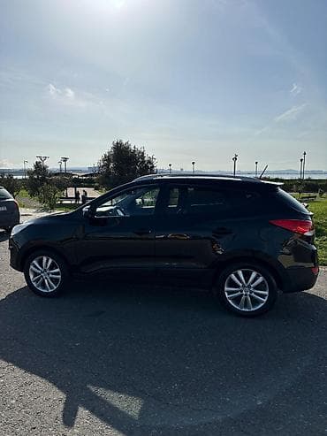Hyundai Tucson: 0.2 l | 2009 il Krossover — 3